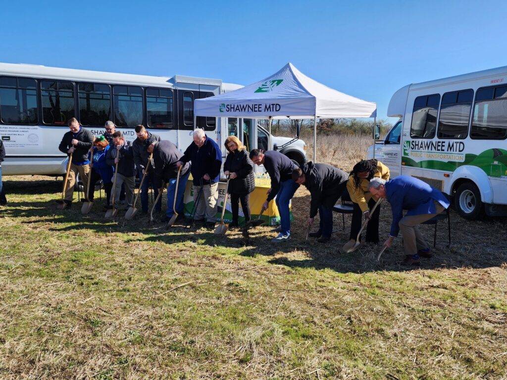 Shawnee Mass Transit groundbreaking employees digging with shovels
